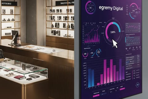 Tienda con máquina de ventas Egremy Digital: pantalla con gráficos de analítica de marketing digital y crecimiento de ventas