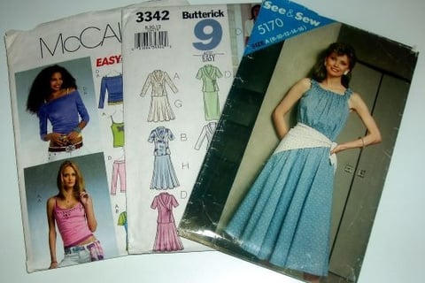 "Assorted vintage and contemporary sewing patterns including McCall's, Butterick, and See & Sew desi