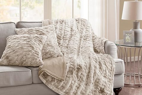 a couch with a blanket on it