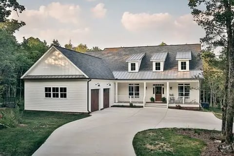 a house with a large driveway and a driveway