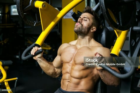 a man doing a chest press machine
