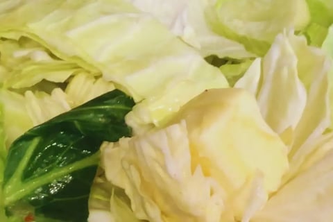 chunk of butter on top of chopped up raw cabbage