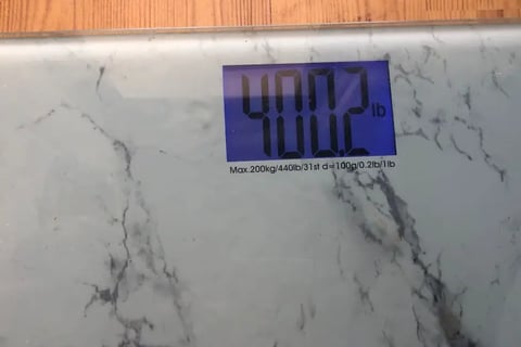 marble looking weight loss scale showing a reading os 400.2lbs