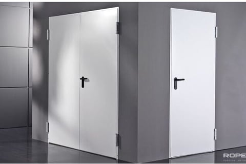 a white cabinet with a cross on the door