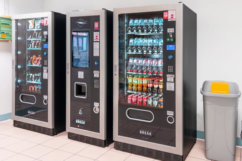 a row of vending machines in a room