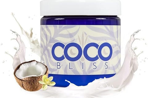 a coconut cream jar with a coconut and coconut milk