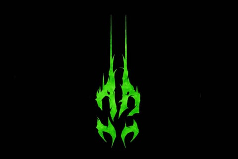 a green dragon head with flames on it