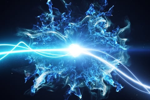 a blue firework with a blue light shining through the center