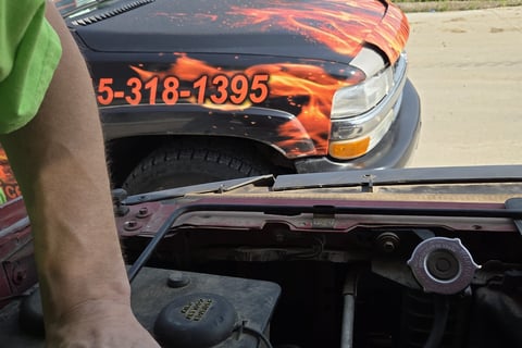Fast T's Spark Plug Replacement Service on location in Waukee Iowa performing a spark plug replacement on a truck