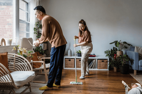 Couple deep cleaning their home before a sale