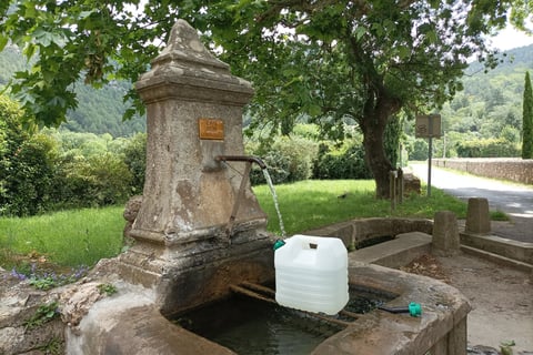 Collecting water from the village fontaine