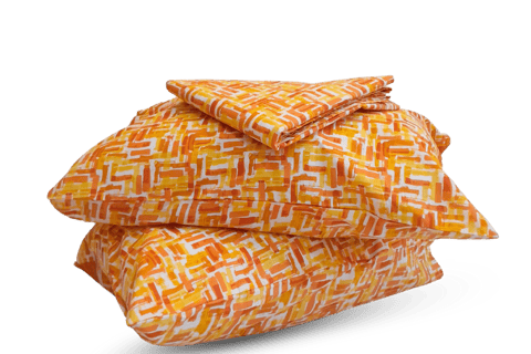 a stack of pillows with a pattern on them- cotton bedsheet