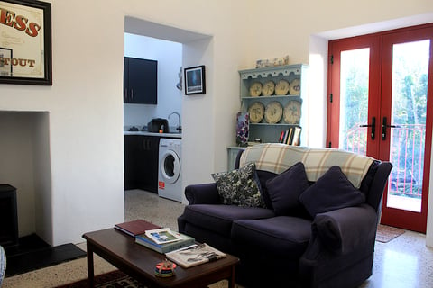 The living room with double doors to balcony