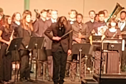 Noah Lathrop conducting wind ensemble