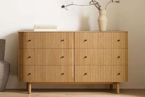 wooden dresser fluted with black handles