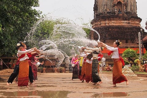people throwing water on each other