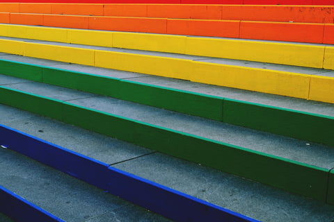 colorful painted steps leading up to a colorful painted staircase