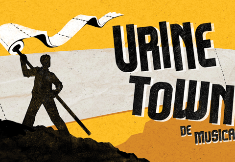 a man holding a flag that says urine town