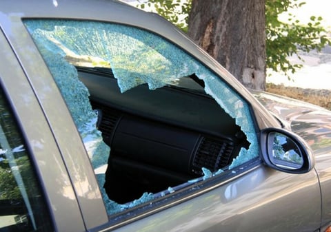 a car with a broken windshield and a broken windshield
