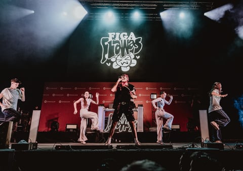 a group of people standing on a stage