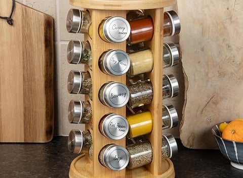 a wooden spice rack with spices and spices