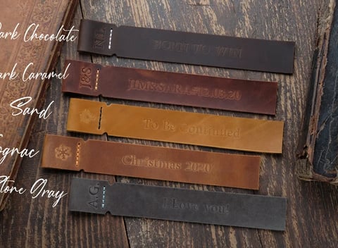 a book with a bookmarked leather strap