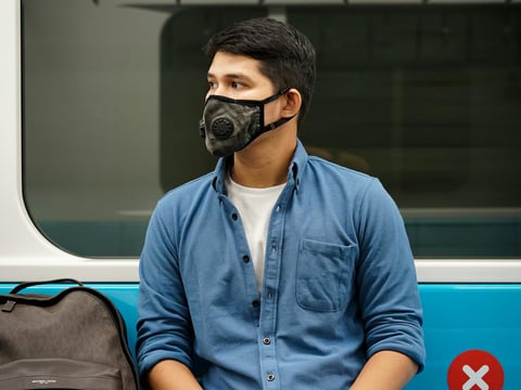 a man wearing a mask and a mask on his face