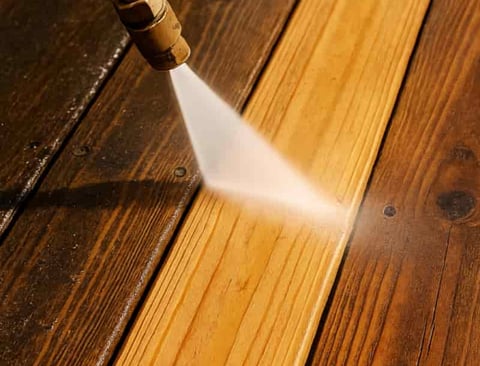 Professional deck washing removing dirt and grime from a wooden deck in Salt Lake City