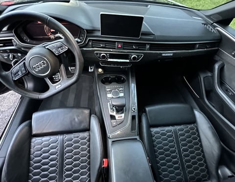 Interior Detailing Image “Deep interior car detailing with steam cleaning and vacuuming of seats"