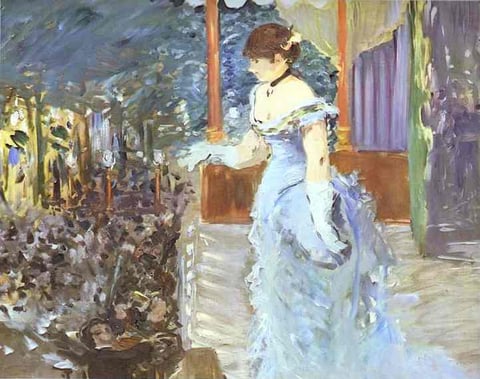 a woman in a blue dress standing in front of a building
