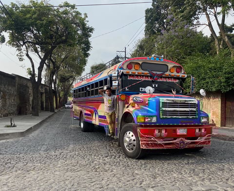 Traditional local bus, known as a chicken bus, in the streets of Antigua, Guatemala.