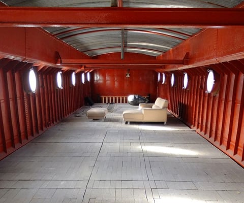 Empty Dutch barge with portholes