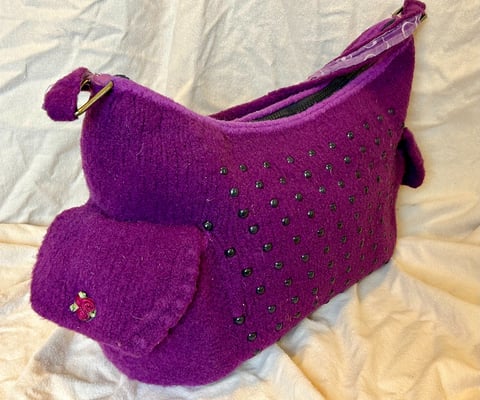 Purple felted purse with black beads and two side pockets 