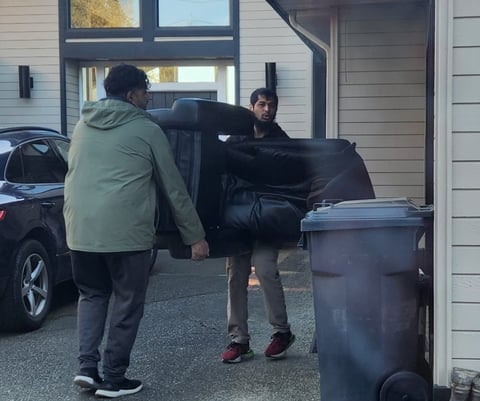 Best affordable reliable movers in Edmonton lifting furniture couch. Fast efficient movers delivery