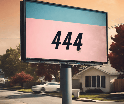 Angel number 444 on a signpost outside a house