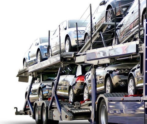 a truck with a large load of cars on it