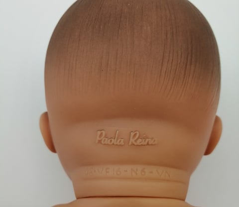 Paola Reina embossed on the back of a dolls neck