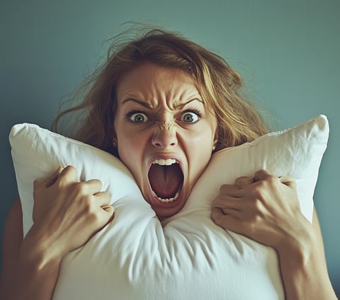 screaming woman with pillow