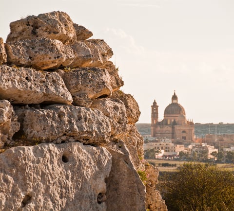 Punic wall in the foreground, St John's church in the distance. 