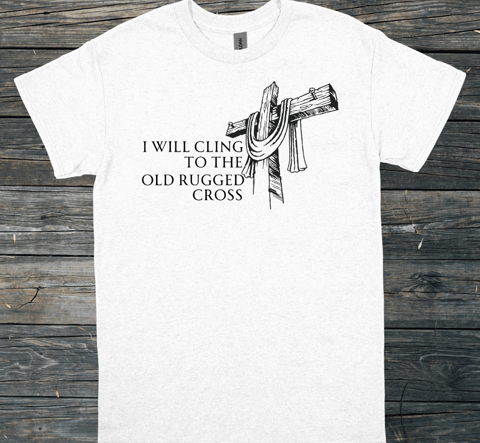 t-shirt mockup on a gray wood floor with the words I will cling to the old rugged cross on the front