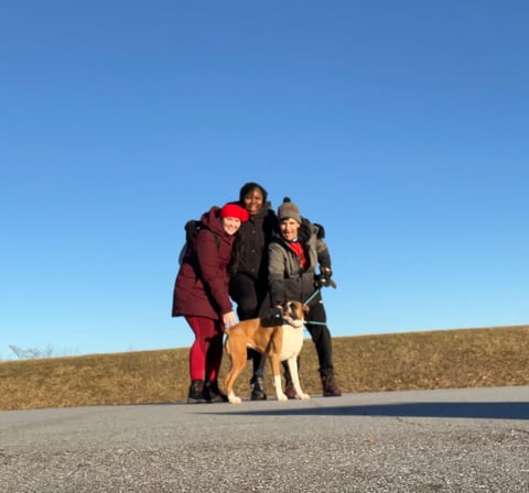 a group of people standing around a dog at Montvale Lookout
