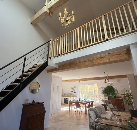 a living room with a staircase and a staircase