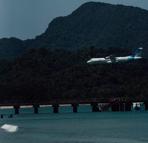 a plane taking off from a beach