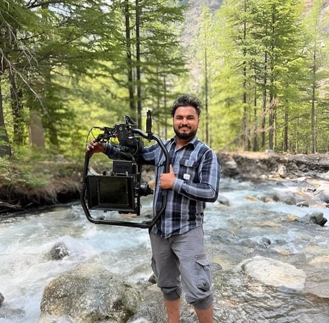sukhvinder singh standing in a stream of water
