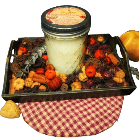 a rustic candle that is displayed with a farmhouse style potpourri bowl