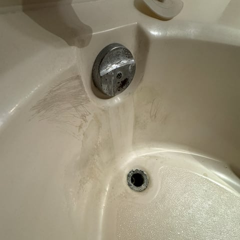 Worn Bathtub from Water Leak that needs to be glazed or replaced by At Hand Heroes in Peoria