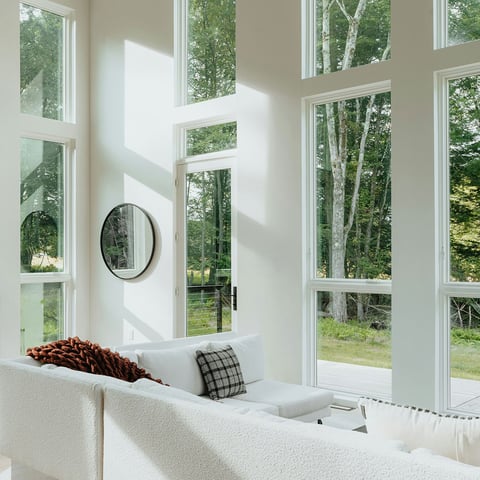 Contemporary living room with minimalist decor and natural light. 