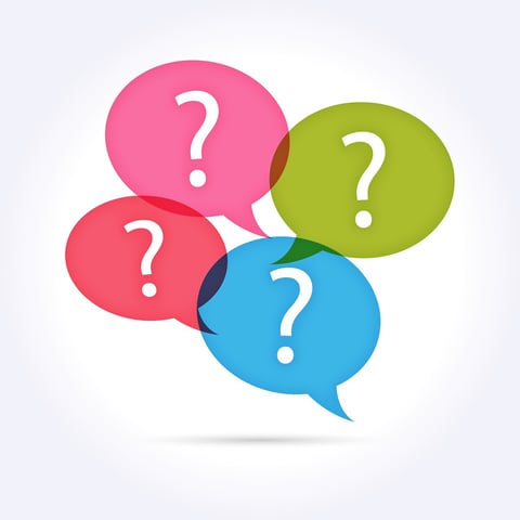 Four questions marks bubbles on a white background