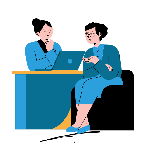 a man and woman sitting at a desk with a laptop