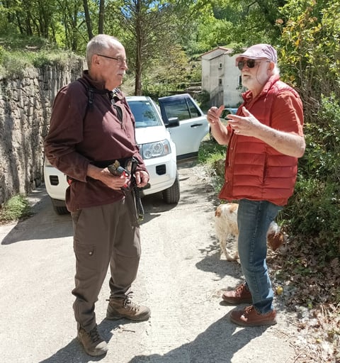 B. chatting to our neighbour Roland.